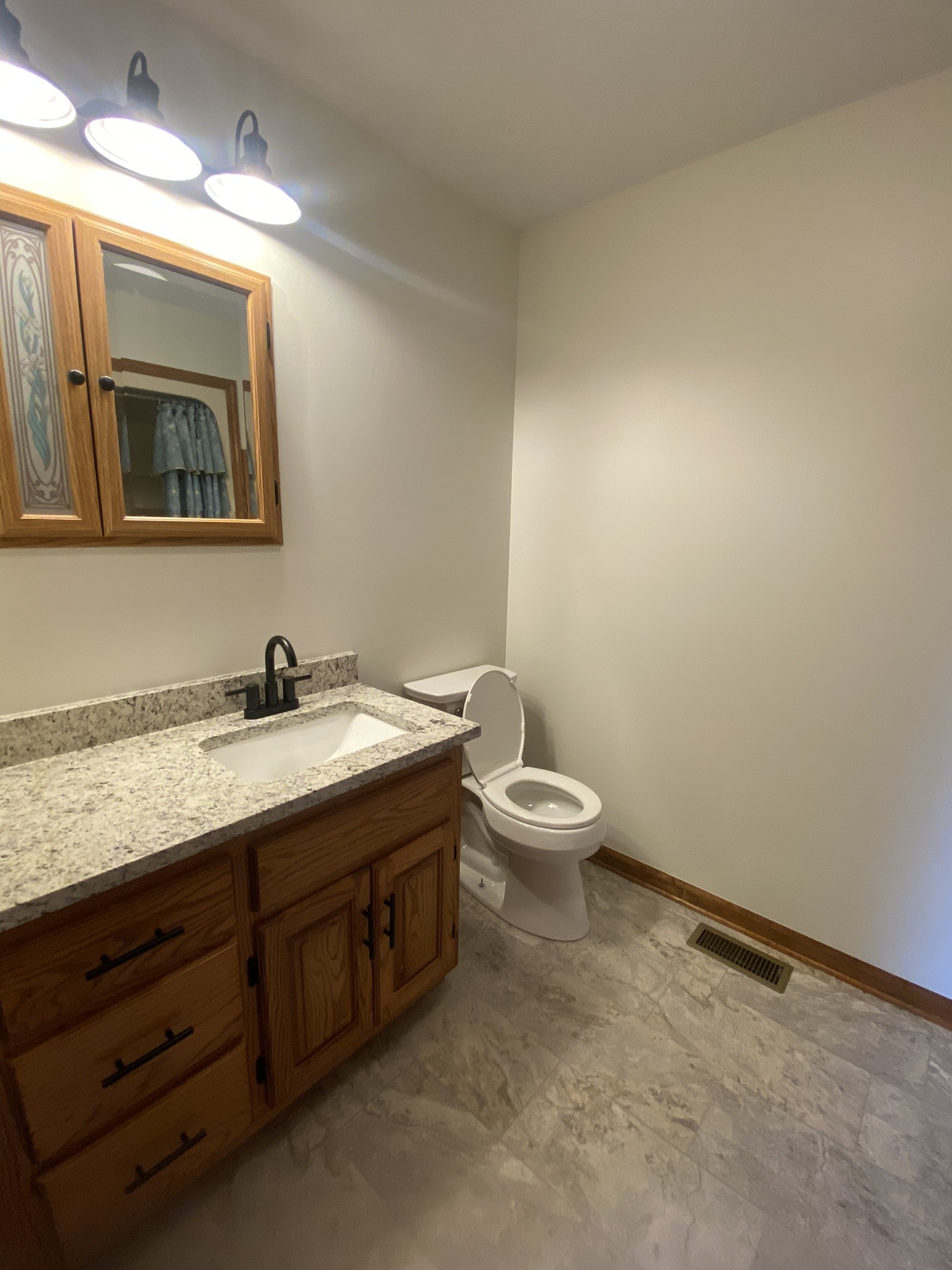 1239 Caney Branch Road Morrison, TN 37357 - Photo 14 of 19 a bathroom with a granite countertop sink mirror and toilet