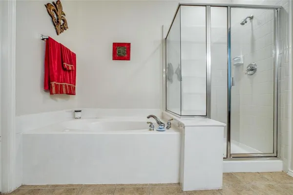 a bathroom with a bathtub and a shower