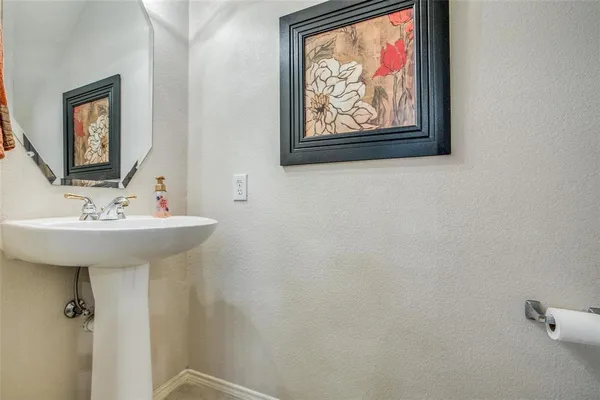 a bathroom with a sink and mirror