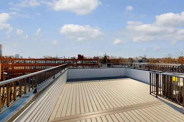 a view of balcony with wooden floor