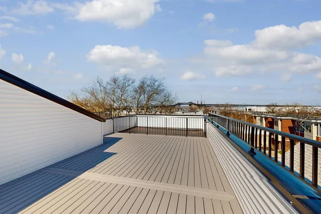 a view of balcony with wooden floor