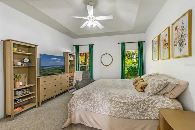 a bedroom with a bed and flat screen tv