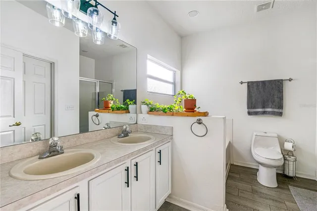 a bathroom with a bathtub and a toilet