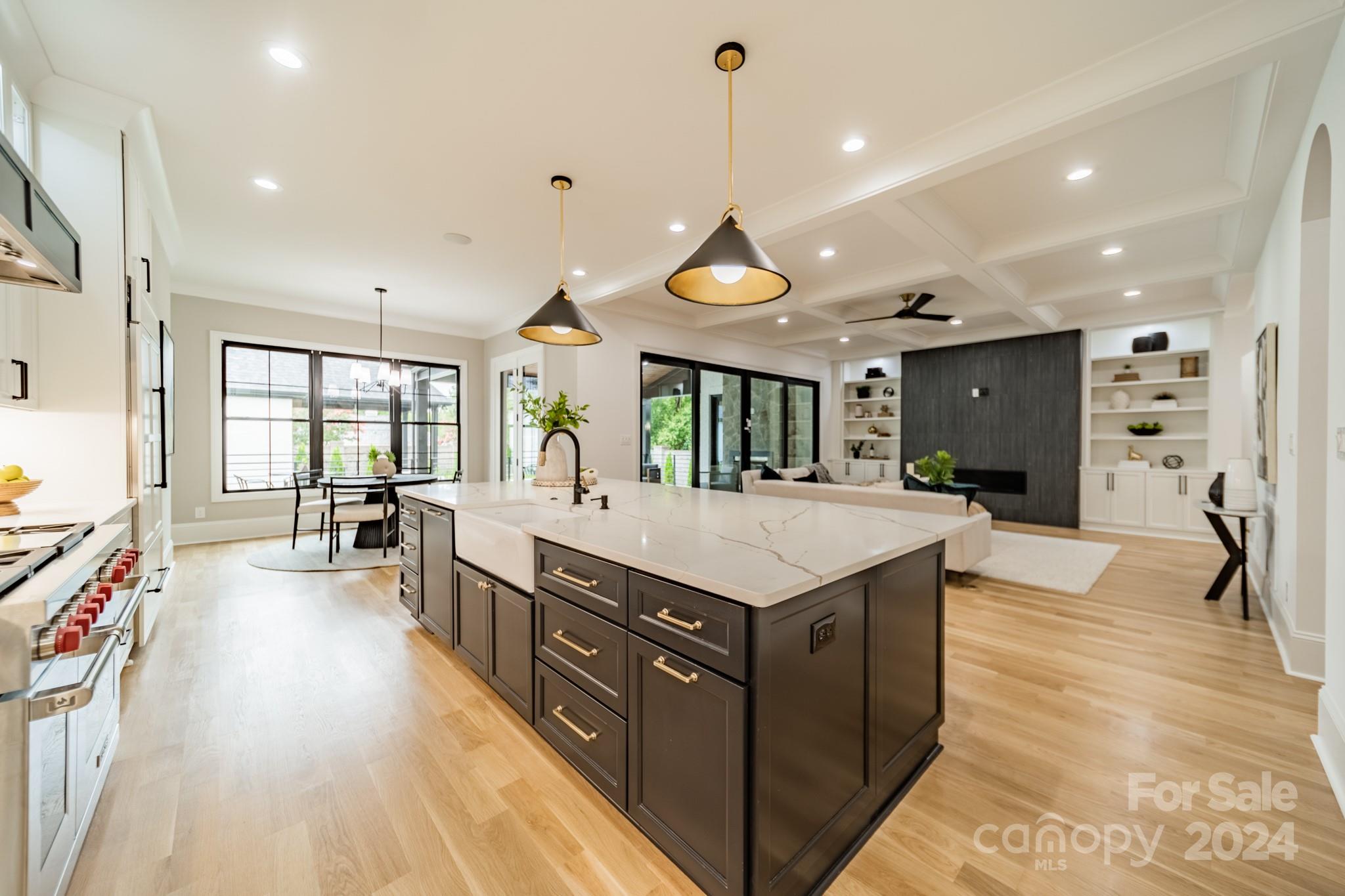 4428 Carmel Road Charlotte, NC 28226 - Photo 15 of 48 a large kitchen with kitchen island a large island in it