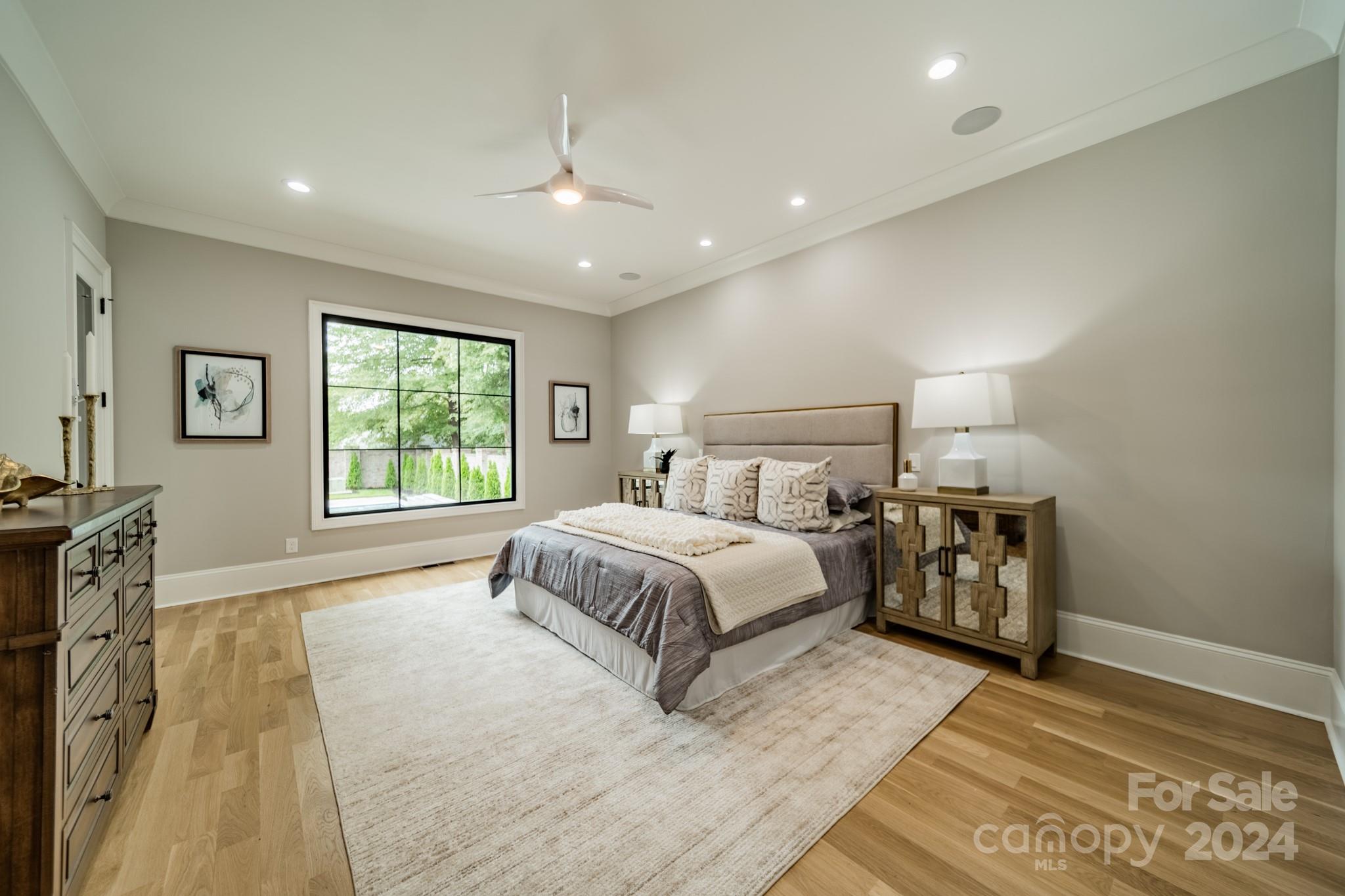 4428 Carmel Road Charlotte, NC 28226 - Photo 20 of 48 a spacious bedroom with a large bed and a tv