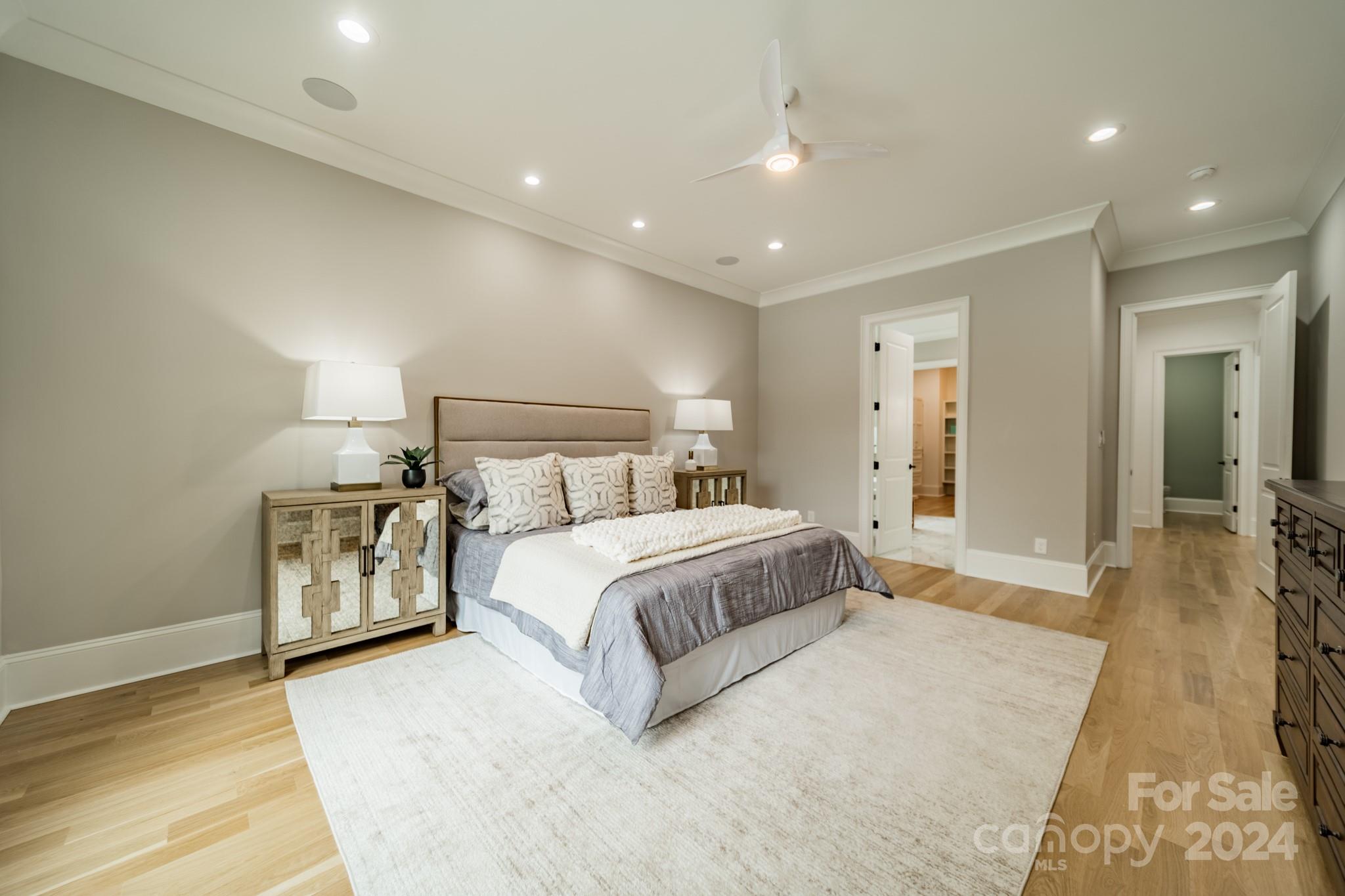 4428 Carmel Road Charlotte, NC 28226 - Photo 21 of 48 a spacious bedroom with a bed and a couch