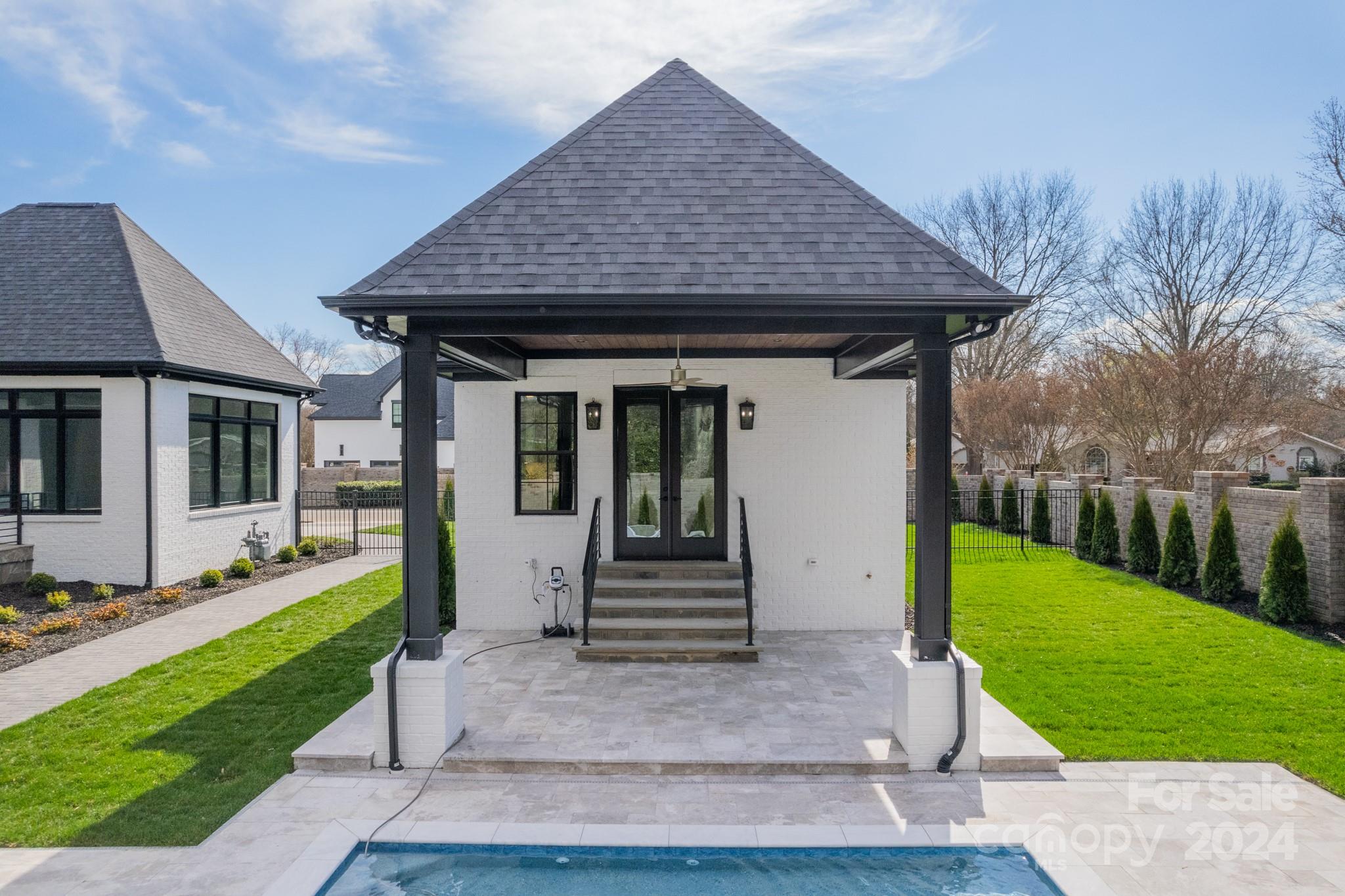 4428 Carmel Road Charlotte, NC 28226 - Photo 43 of 48 a front view of a house with garden