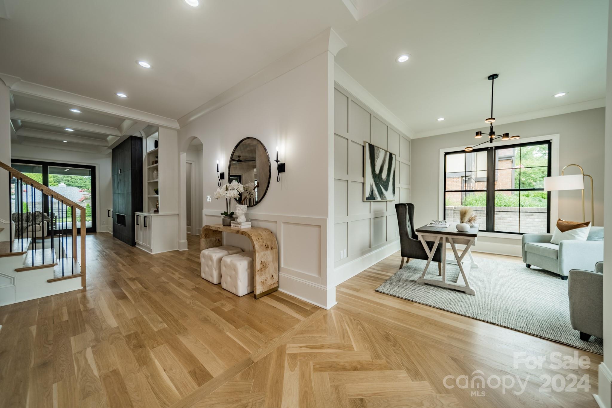 4428 Carmel Road Charlotte, NC 28226 - Photo 8 of 48 a dining room with furniture and a chandelier