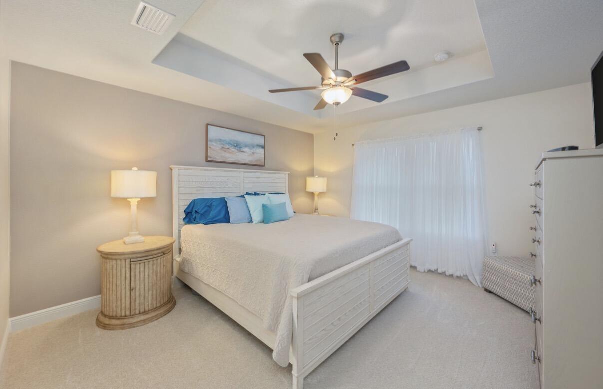 2191 Jernigan Drive Crestview, FL 32536 - Photo 18 of 42 a bedroom with a bed and a chandelier