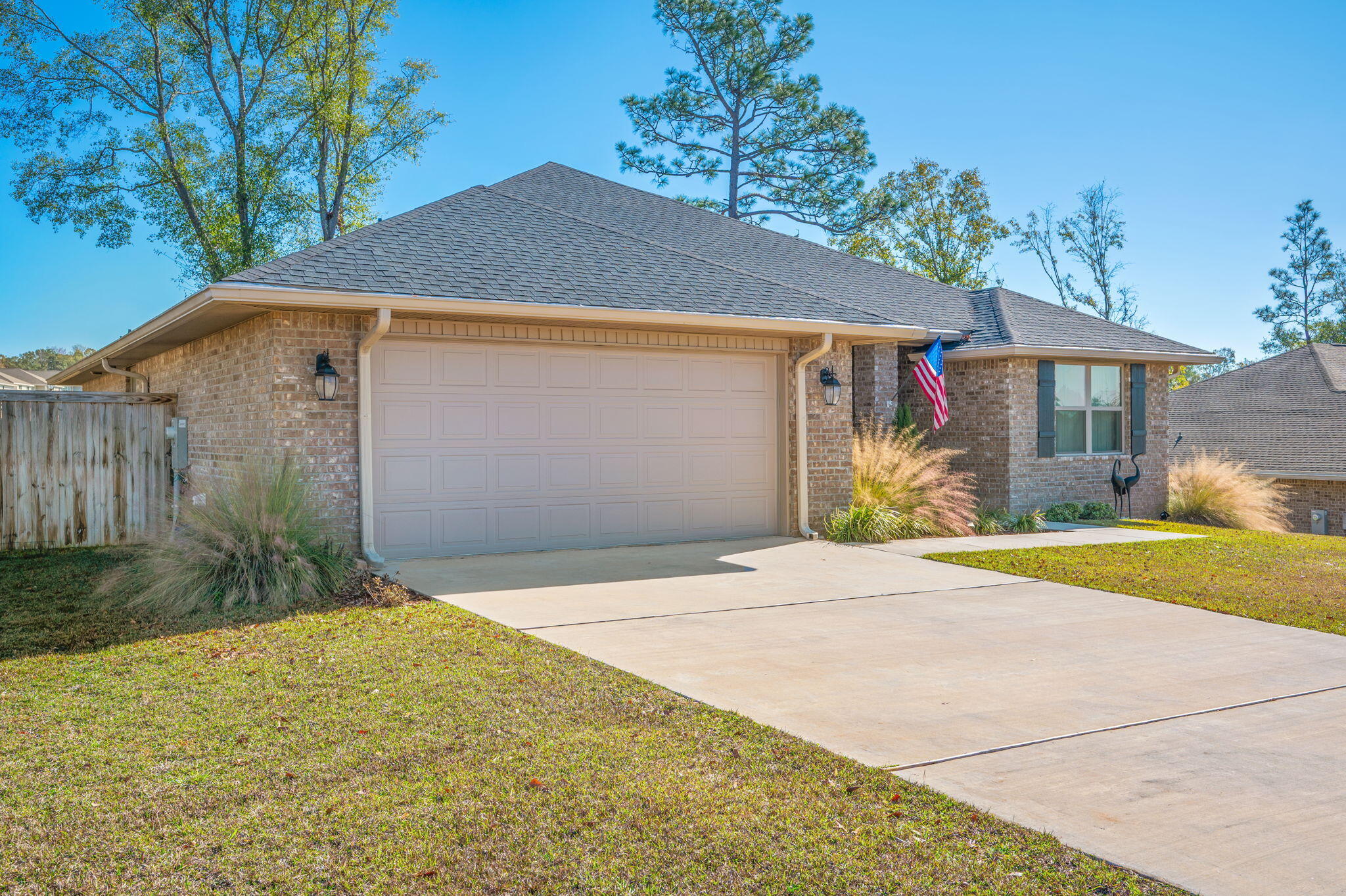 2191 Jernigan Drive Crestview, FL 32536 - Photo 2 of 42 a front view of a house with a yard and garage