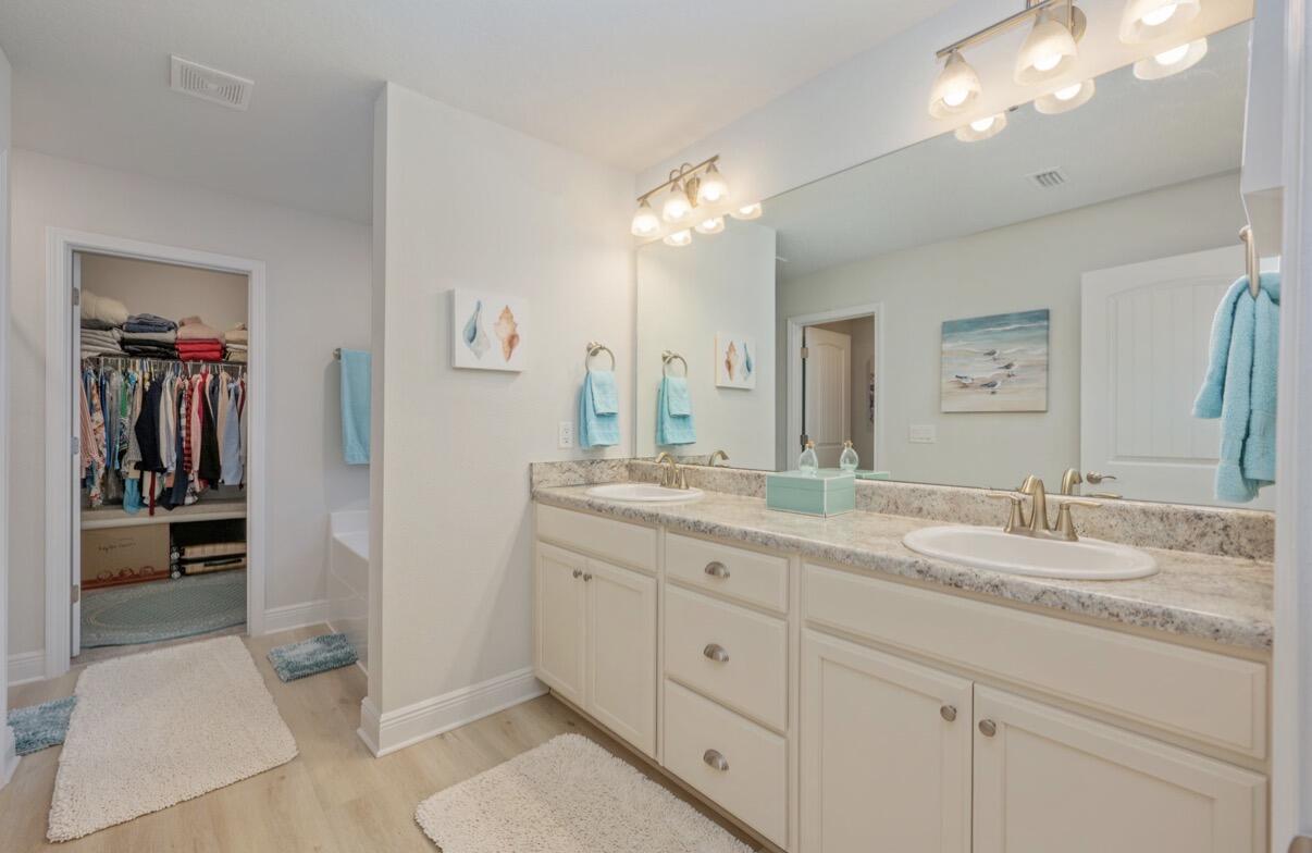 2191 Jernigan Drive Crestview, FL 32536 - Photo 21 of 42 a bathroom with a double vanity sink and a mirror