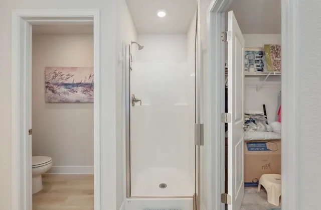 a bathroom with a granite countertop mirror