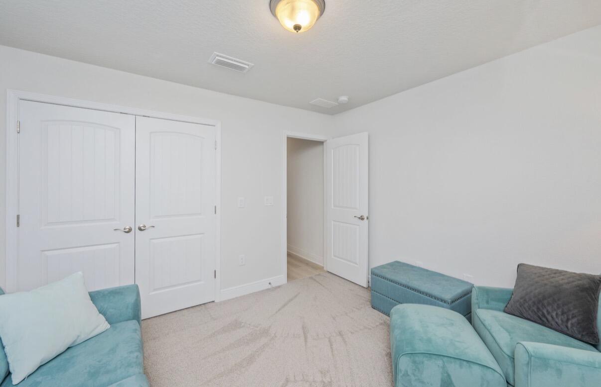 2191 Jernigan Drive Crestview, FL 32536 - Photo 33 of 42 a living room with furniture and a lamp