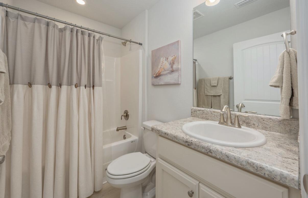 2191 Jernigan Drive Crestview, FL 32536 - Photo 34 of 42 a bathroom with a granite countertop sink and a mirror