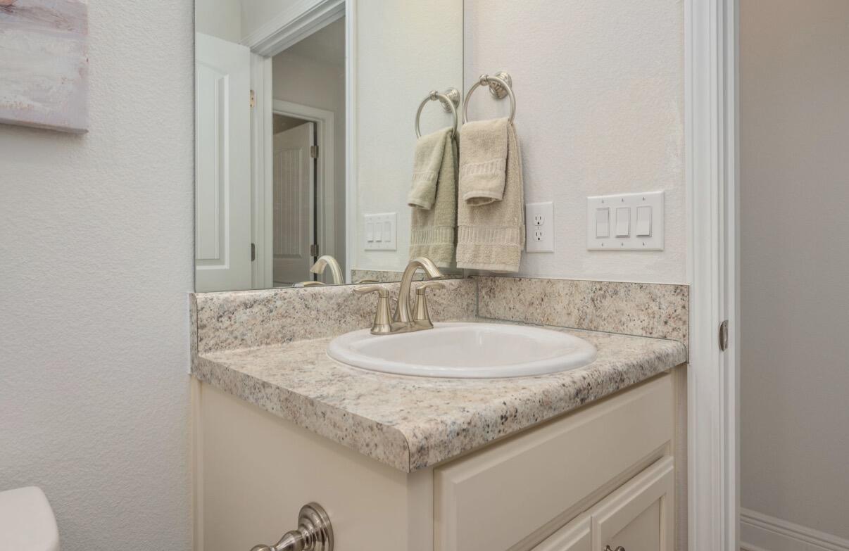 2191 Jernigan Drive Crestview, FL 32536 - Photo 36 of 42 a bathroom with a granite countertop sink and a mirror