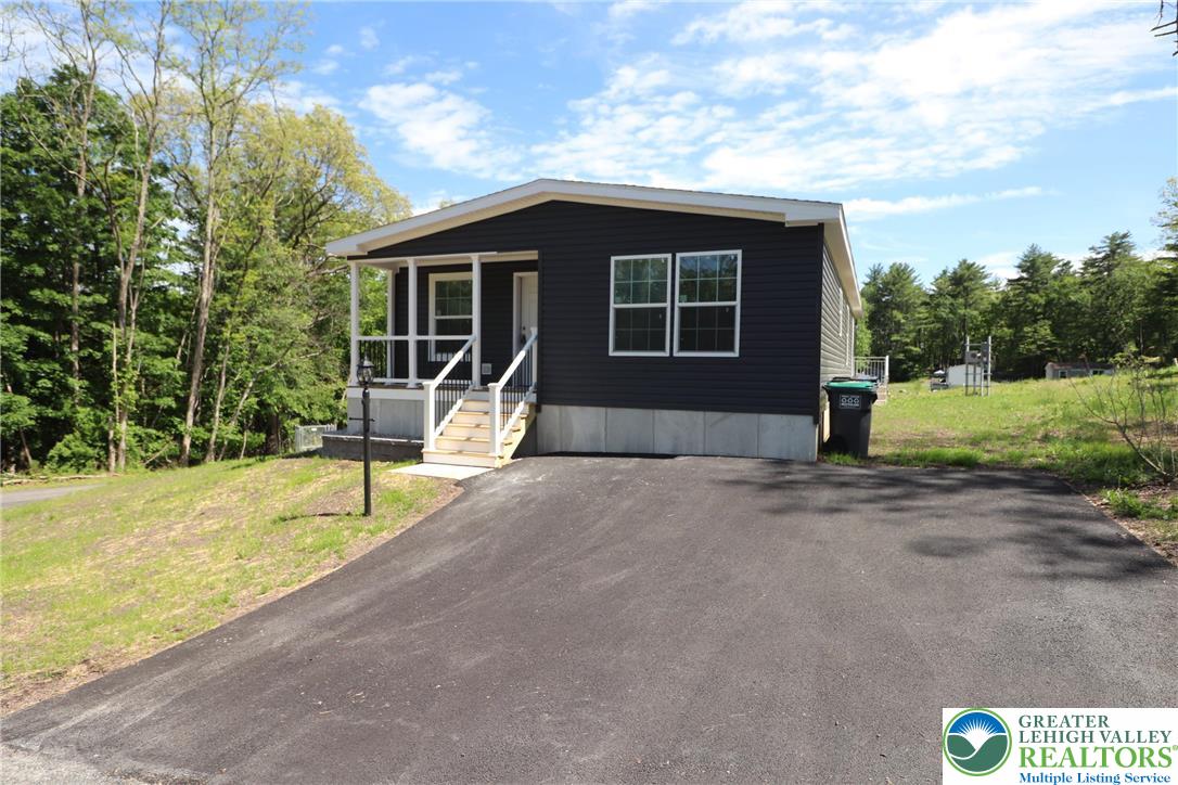 5020 Old Timber Road Stroudsburg, PA 18360 - Photo 1 of 32 a house with a garden space