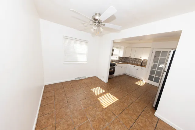 a view of livingroom with hardwood floor and a ceiling fan