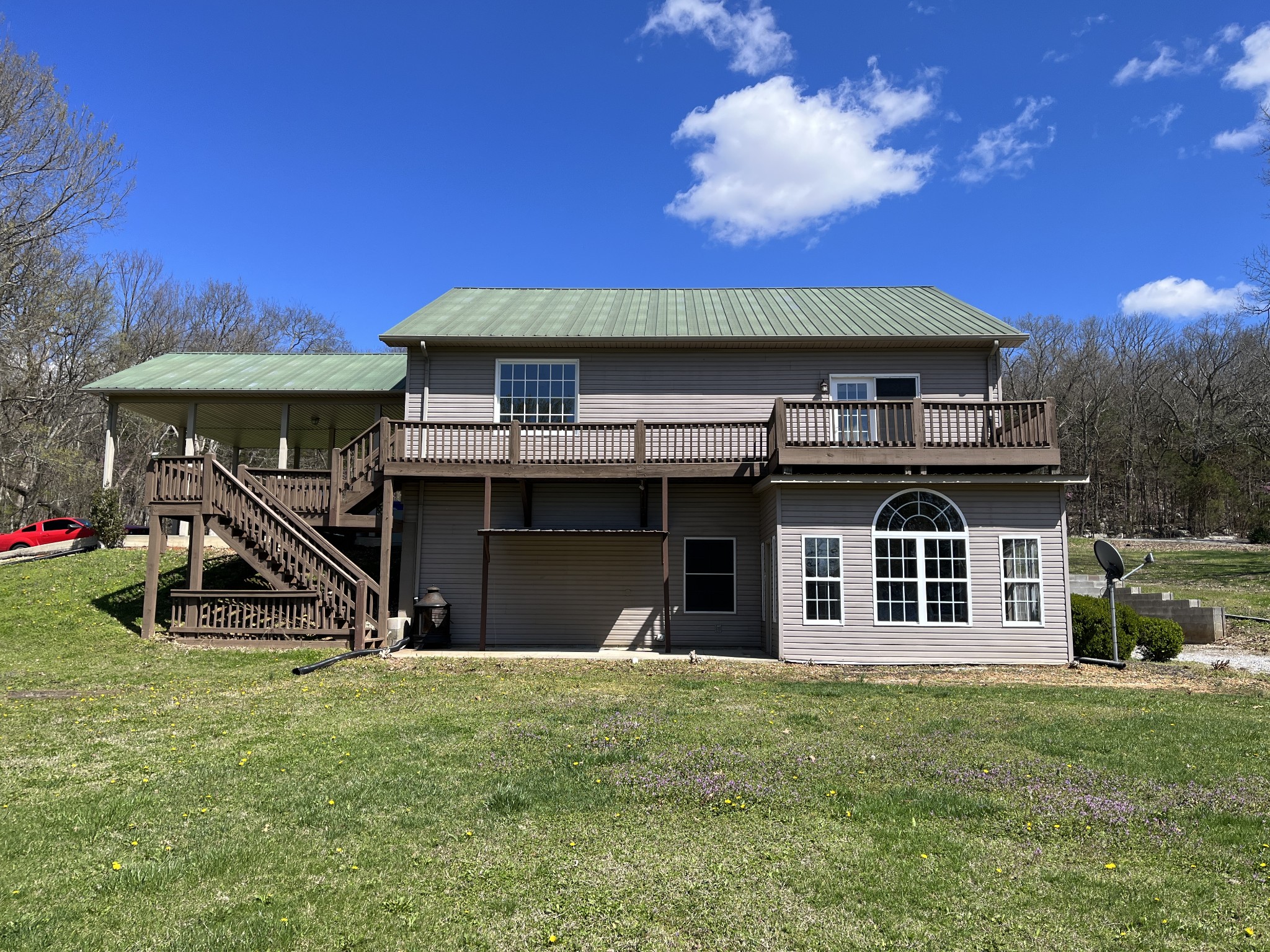 1282 East Roarks Cove Road Decherd, TN 37324 - Photo 5 of 24 a front view of a house with a yard