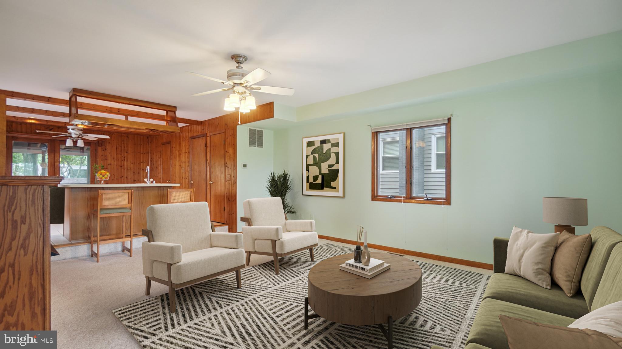 1718 Quantico Road Edgewater, MD 21037 - Photo 11 of 54 a living room with furniture a rug and a chandelier