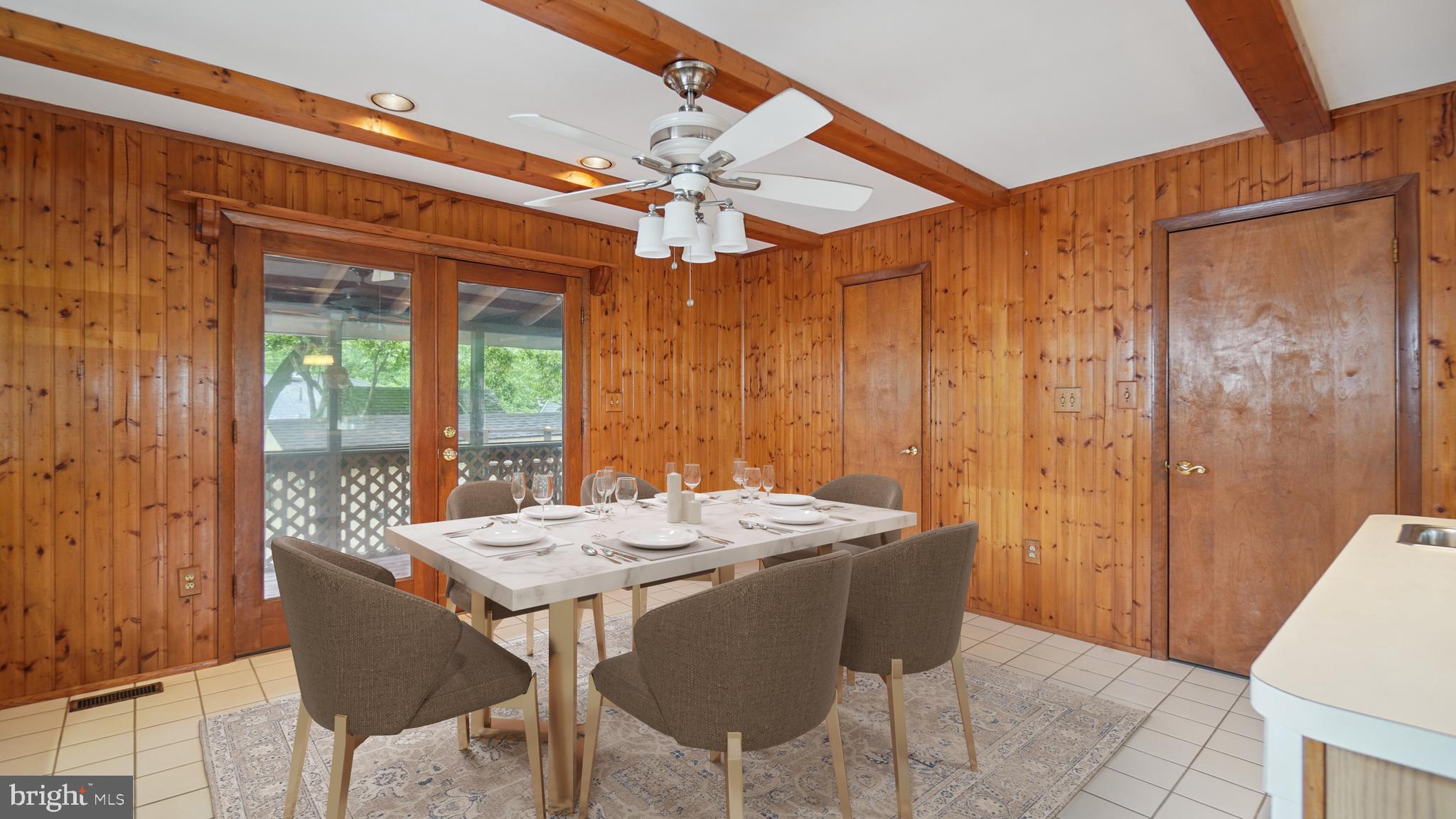 1718 Quantico Road Edgewater, MD 21037 - Photo 17 of 54 a view of a dining room with furniture window and outside view