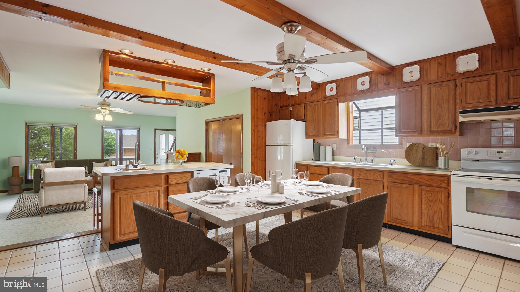 1718 Quantico Road Edgewater, MD 21037 - Photo 20 of 54 a kitchen with a dining table and chairs