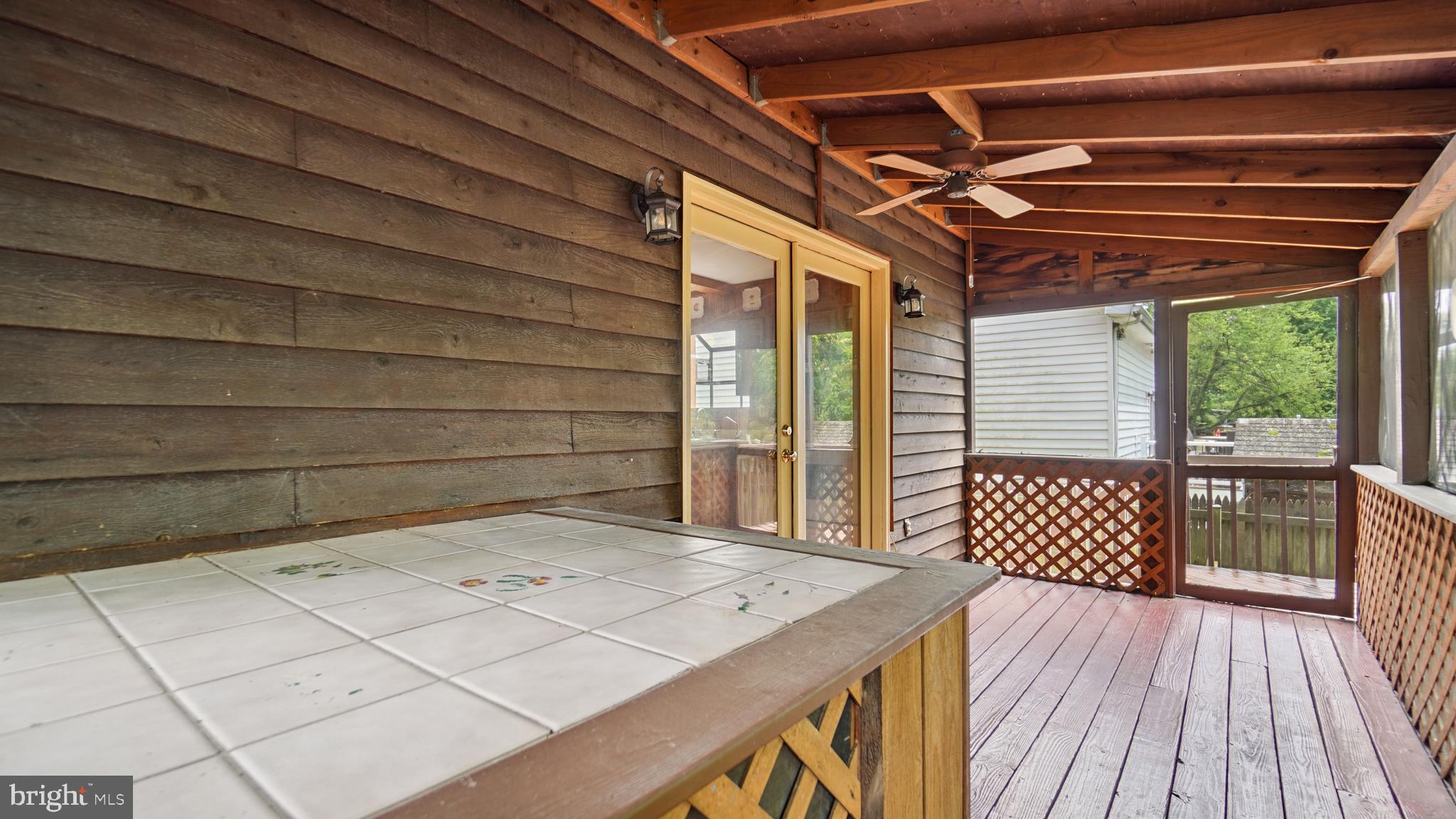 1718 Quantico Road Edgewater, MD 21037 - Photo 25 of 54 a view of a wooden door and outdoor space