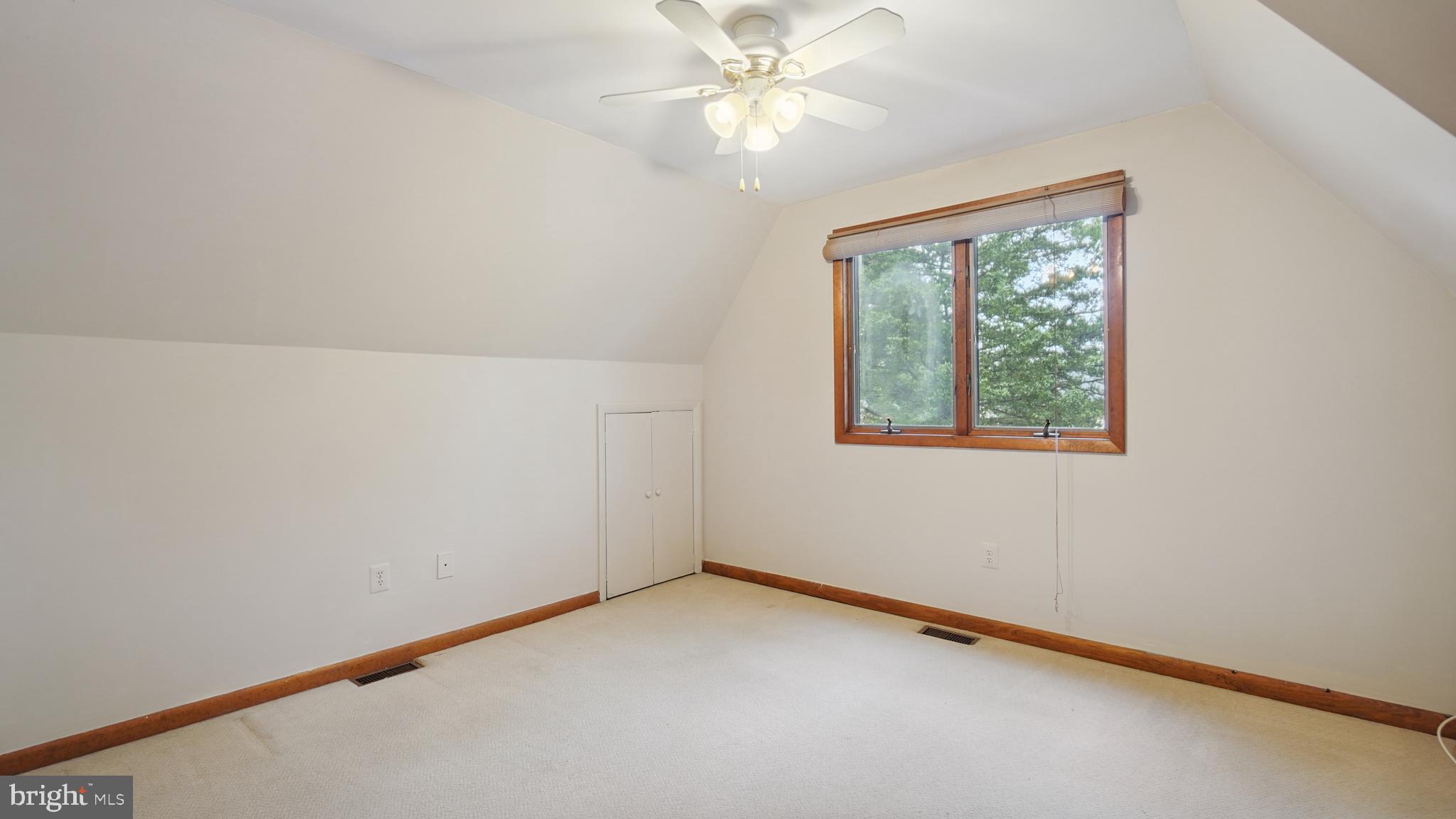 1718 Quantico Road Edgewater, MD 21037 - Photo 32 of 54 an empty room with a window and a fan