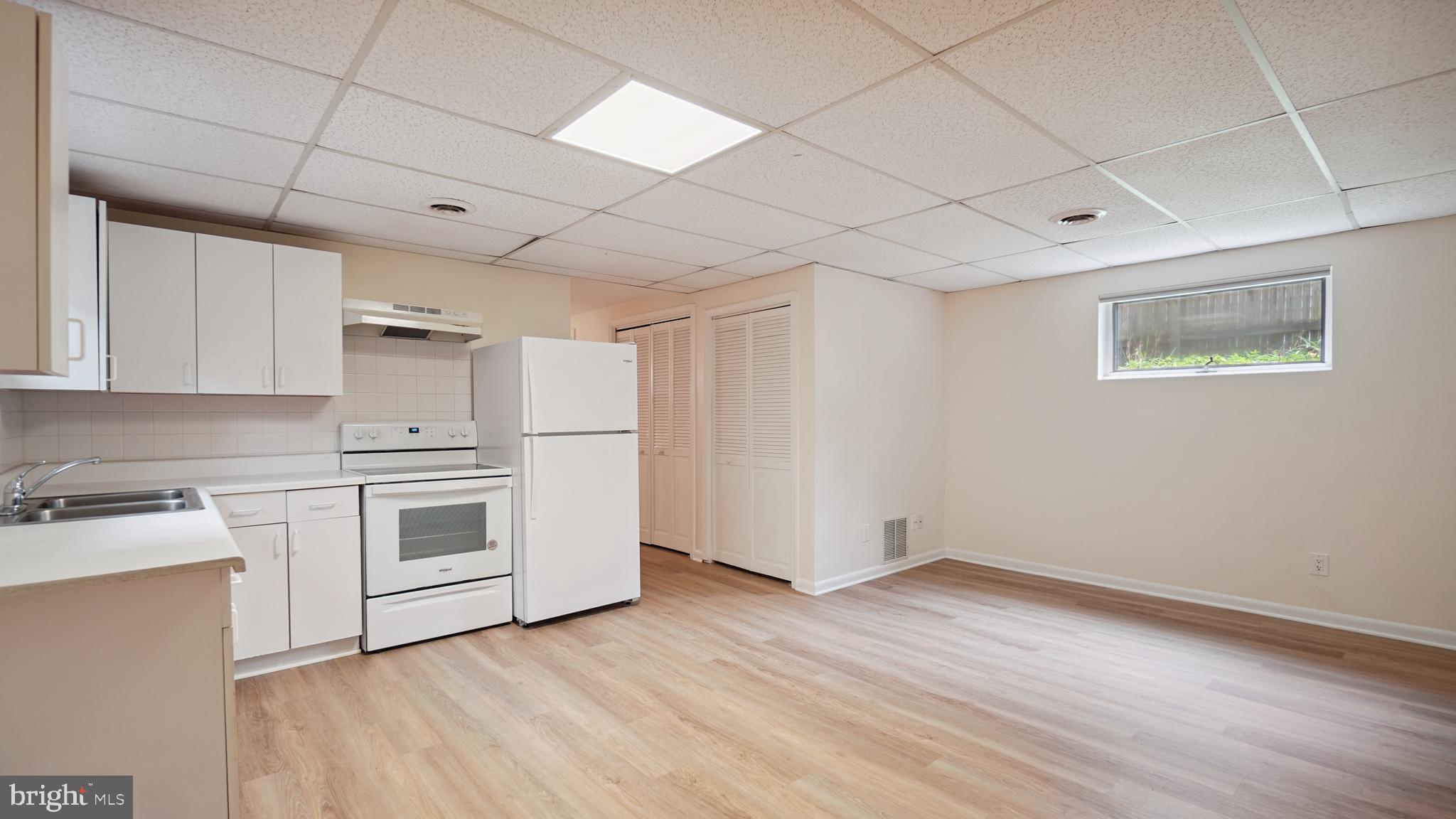1718 Quantico Road Edgewater, MD 21037 - Photo 38 of 54 a view of a kitchen with wooden floor and electronic appliances
