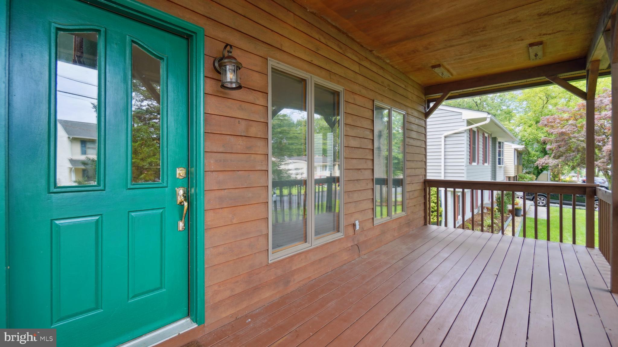 1718 Quantico Road Edgewater, MD 21037 - Photo 4 of 54 a view of a porch with wooden floor and outdoor space