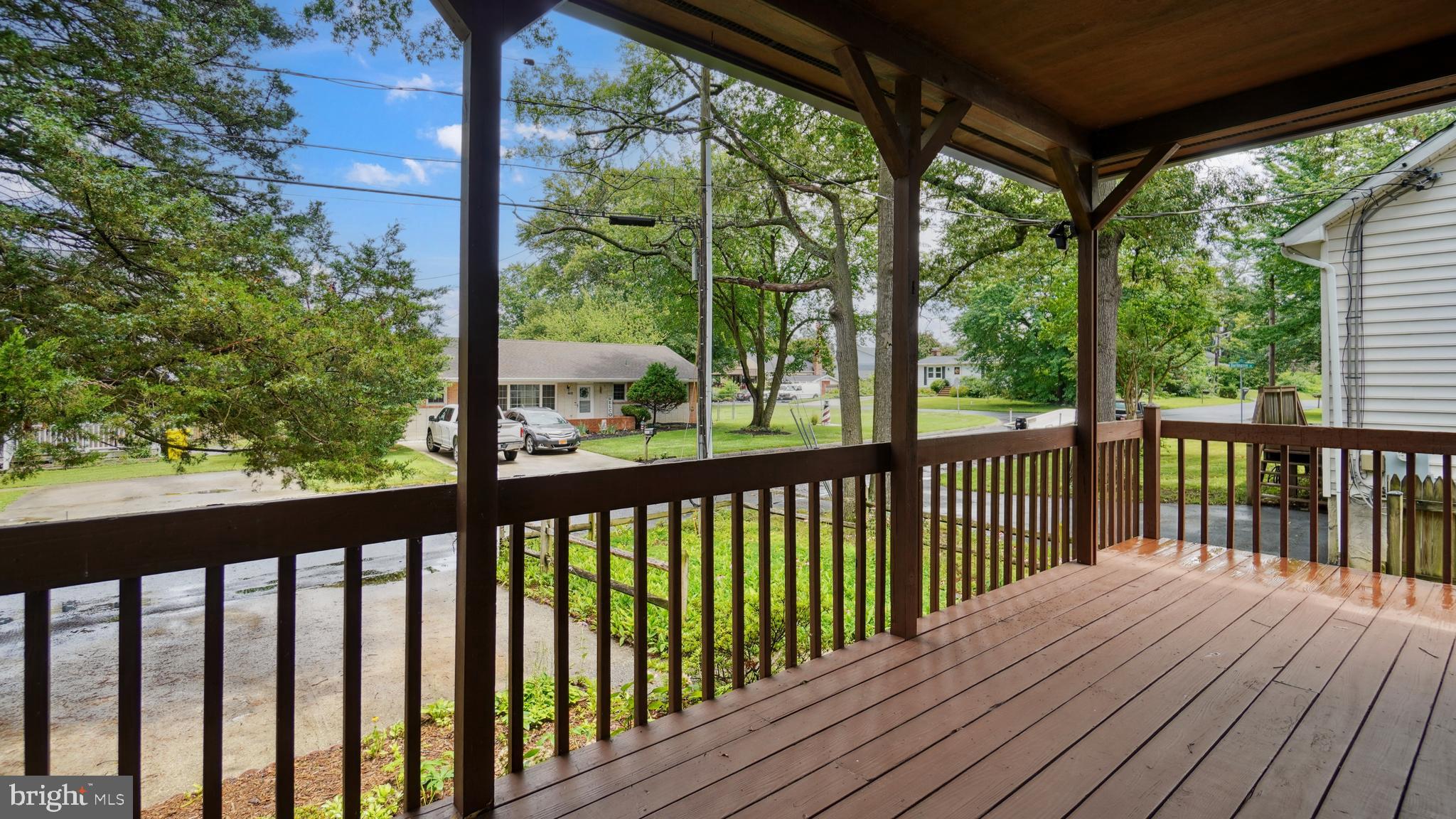 1718 Quantico Road Edgewater, MD 21037 - Photo 5 of 54 a view of a wooden balcony with a yard