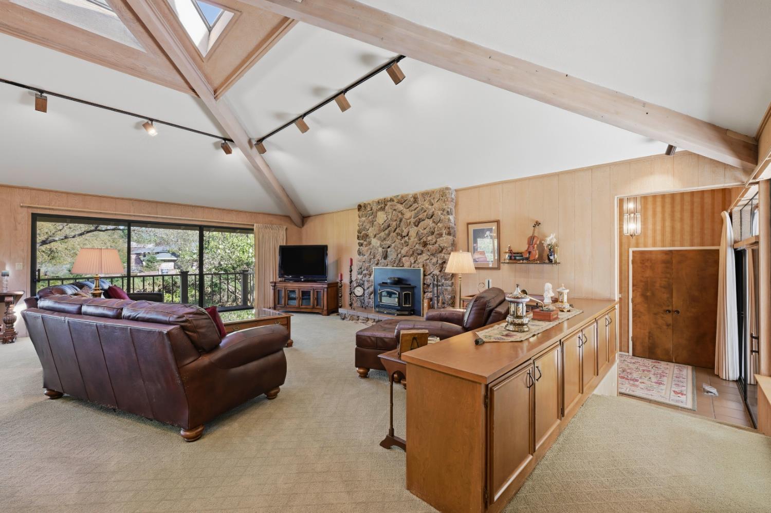 8860 Auburn Valley Road Auburn, CA 95602 - Photo 12 of 46 a living room with furniture fireplace and a large window