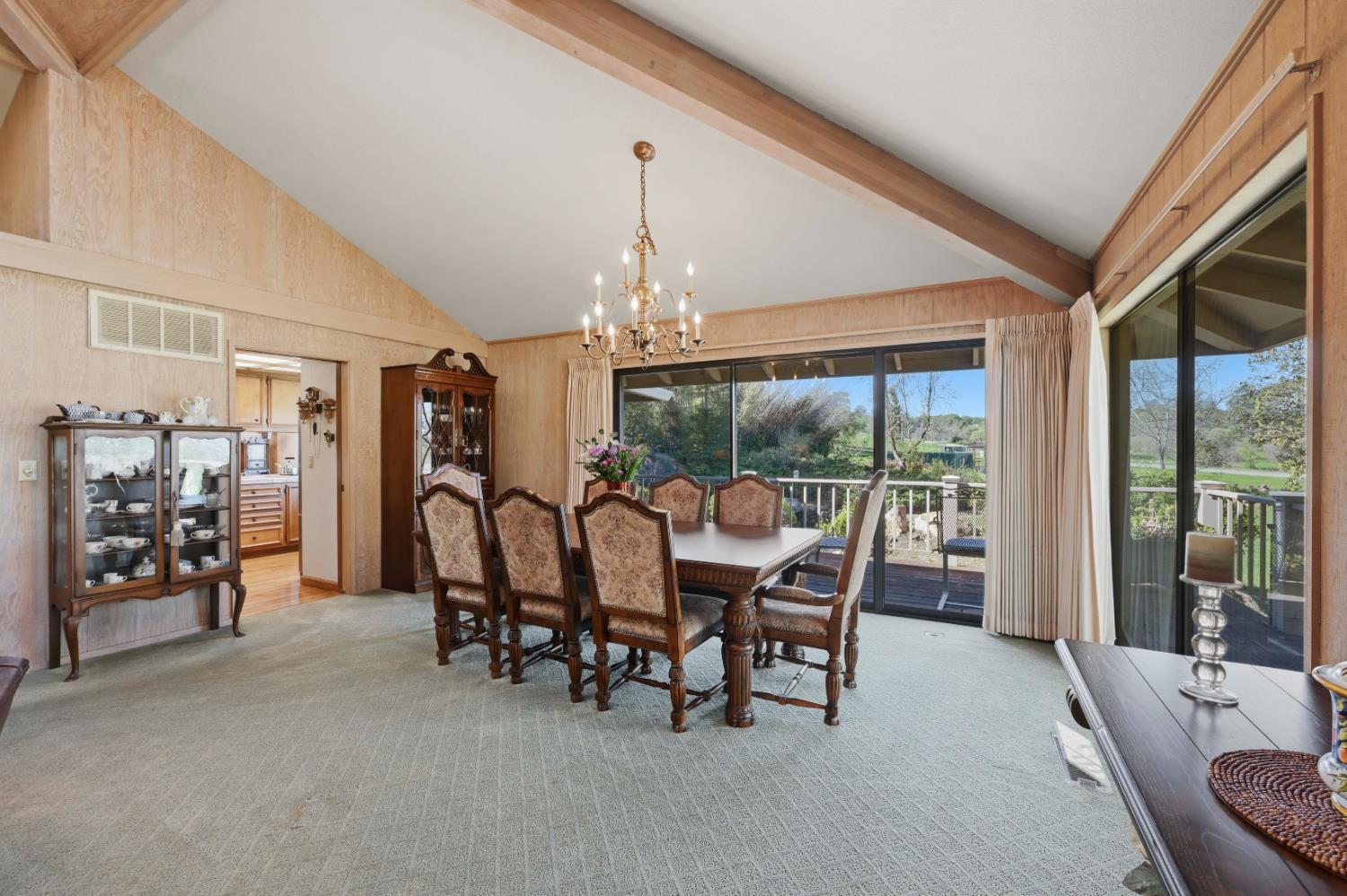 8860 Auburn Valley Road Auburn, CA 95602 - Photo 16 of 46 a dining room with furniture mountain and a chandelier