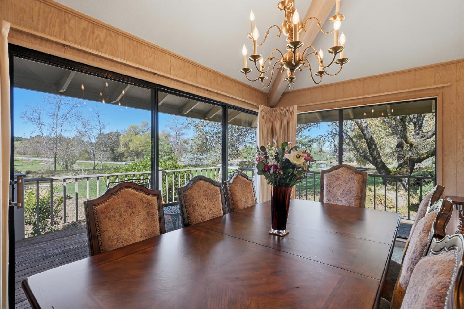 8860 Auburn Valley Road Auburn, CA 95602 - Photo 18 of 46 a view of a dining room with furniture chandelier and wooden floor