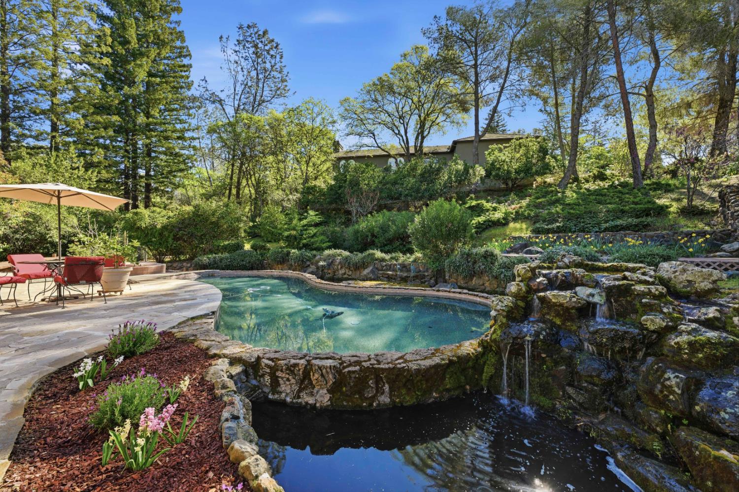 8860 Auburn Valley Road Auburn, CA 95602 - Photo 2 of 46 a view of a wooden house with a yard