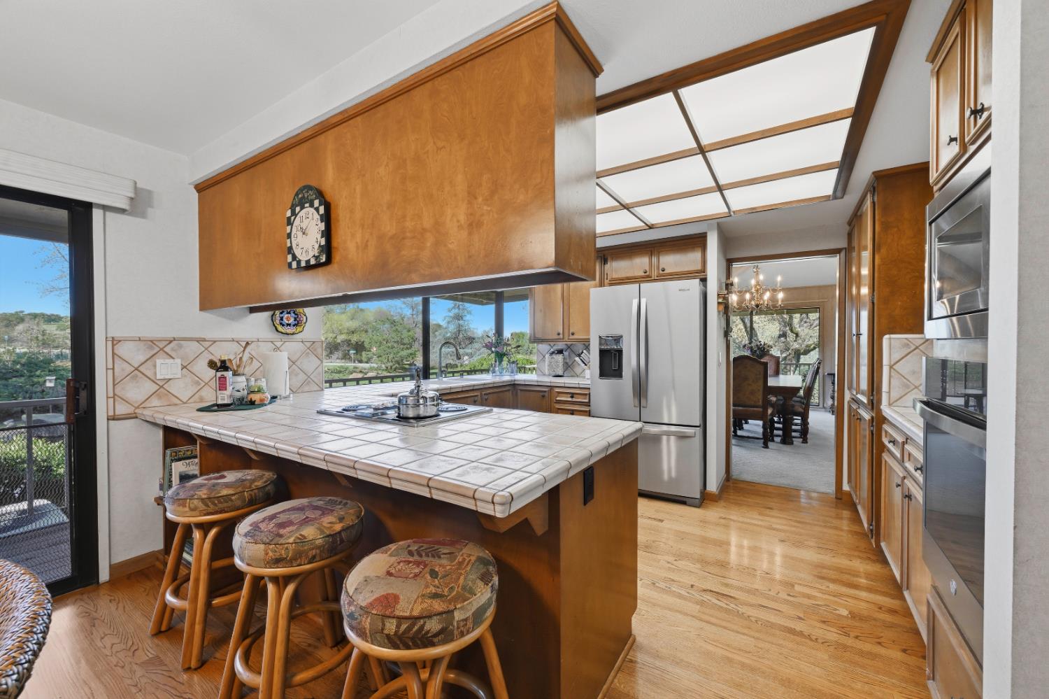 8860 Auburn Valley Road Auburn, CA 95602 - Photo 22 of 46 a kitchen with stainless steel appliances granite countertop a sink and a refrigerator