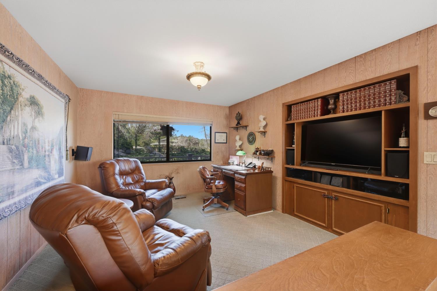 8860 Auburn Valley Road Auburn, CA 95602 - Photo 29 of 46 a living room with furniture and a flat screen tv