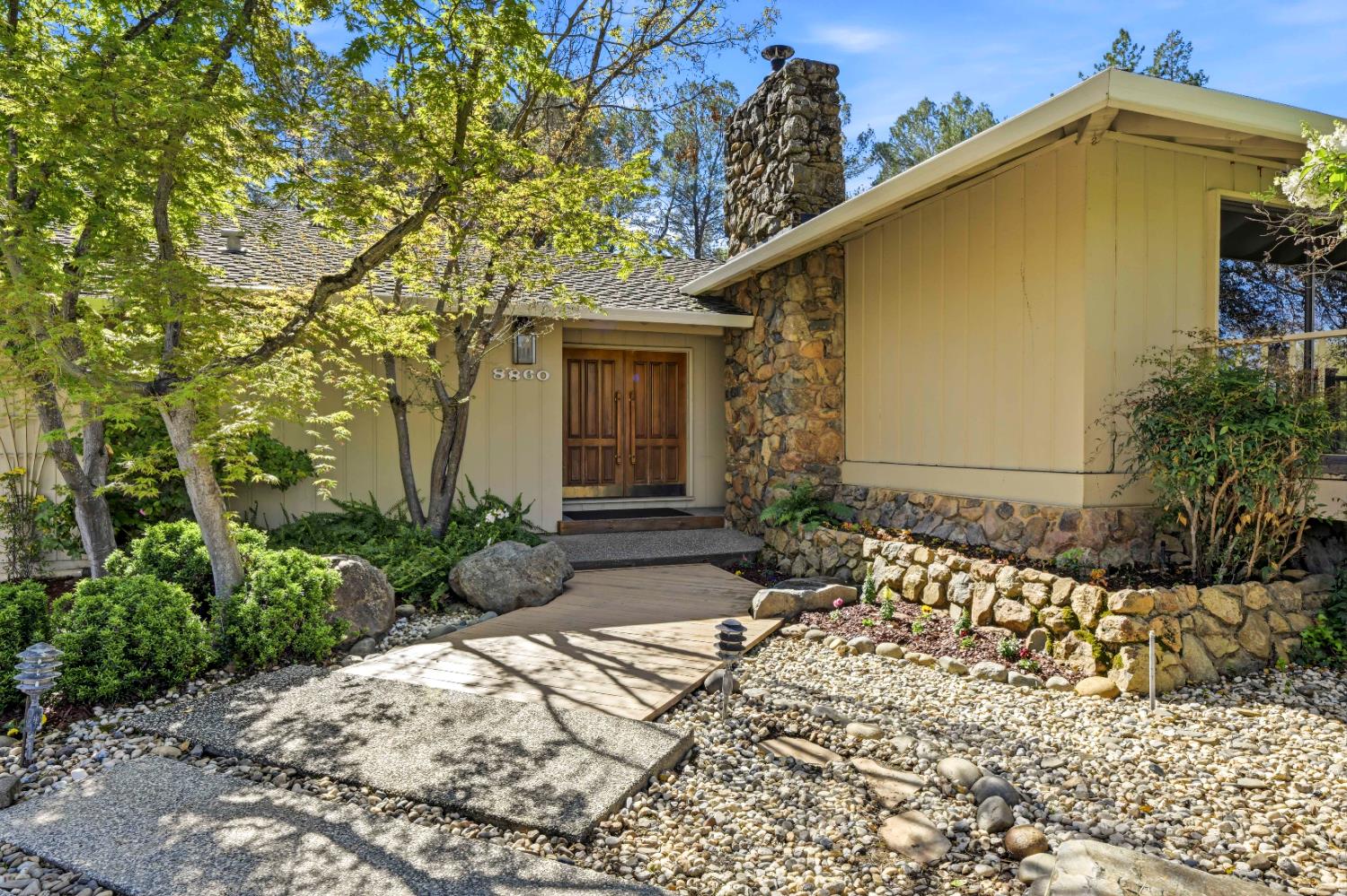 8860 Auburn Valley Road Auburn, CA 95602 - Photo 9 of 46 a front view of a house with a yard