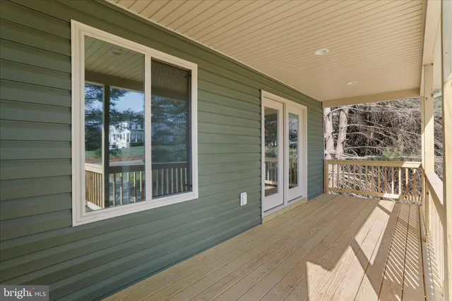 a view of a house with wooden floor and a window