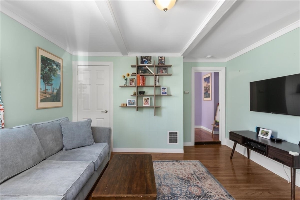 9 John Street Waltham, MA 02453 - Photo 11 of 43 a living room with furniture and a flat screen tv