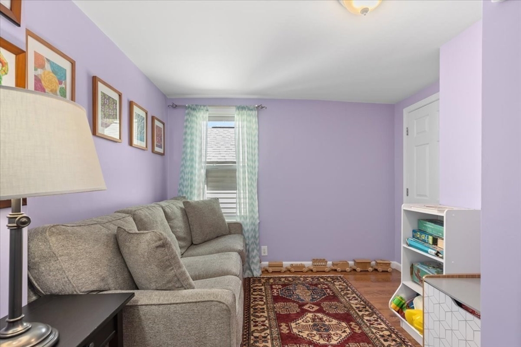 9 John Street Waltham, MA 02453 - Photo 12 of 43 a living room with furniture and a couch