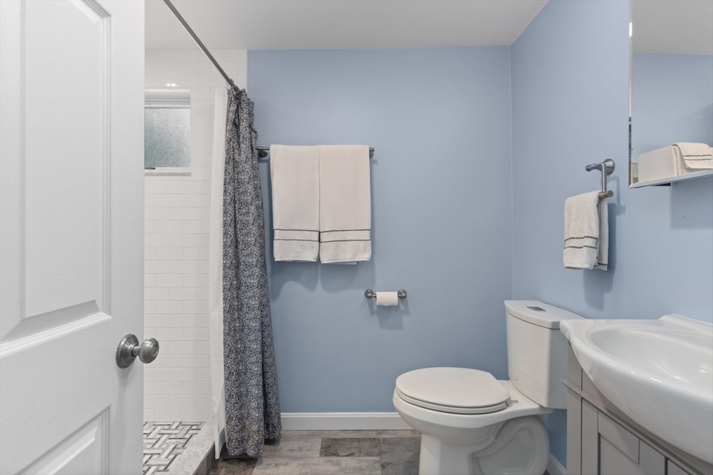 9 John Street Waltham, MA 02453 - Photo 14 of 43 a bathroom with a toilet and a sink