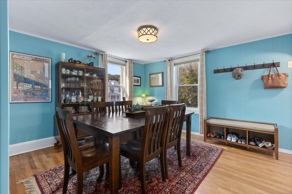 9 John Street Waltham, MA 02453 - Photo 16 of 43 a view of a dining room with furniture window and wooden floor