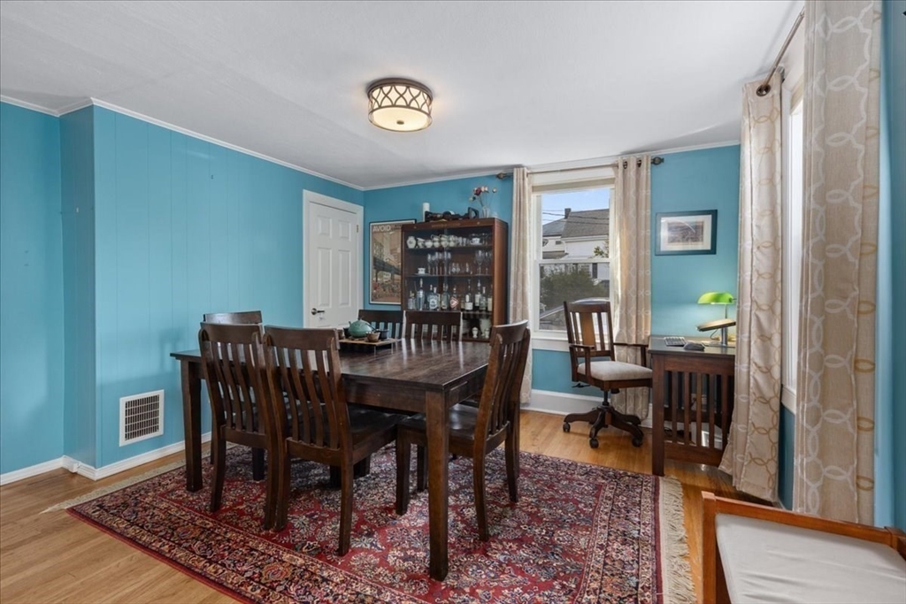 9 John Street Waltham, MA 02453 - Photo 17 of 43 a view of a dining room with furniture window and wooden floor