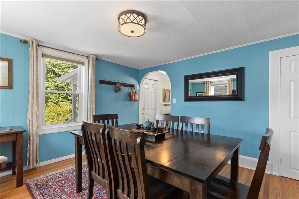 9 John Street Waltham, MA 02453 - Photo 19 of 43 a view of a dining room with furniture window and wooden floor