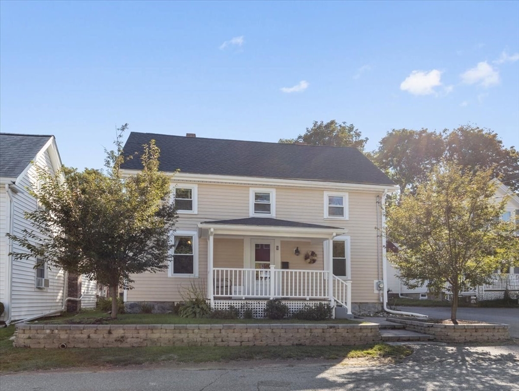 9 John Street Waltham, MA 02453 - Photo 2 of 43 a front view of a house with a yard