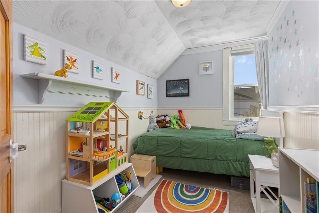 9 John Street Waltham, MA 02453 - Photo 27 of 43 a living room with baby crib furniture and a window