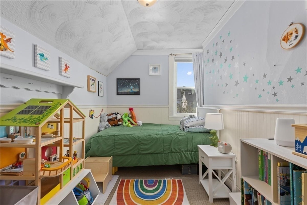 9 John Street Waltham, MA 02453 - Photo 28 of 43 a bedroom with furniture and a wooden floor