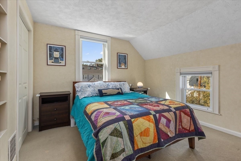 9 John Street Waltham, MA 02453 - Photo 30 of 43 a bedroom with a bed and a window