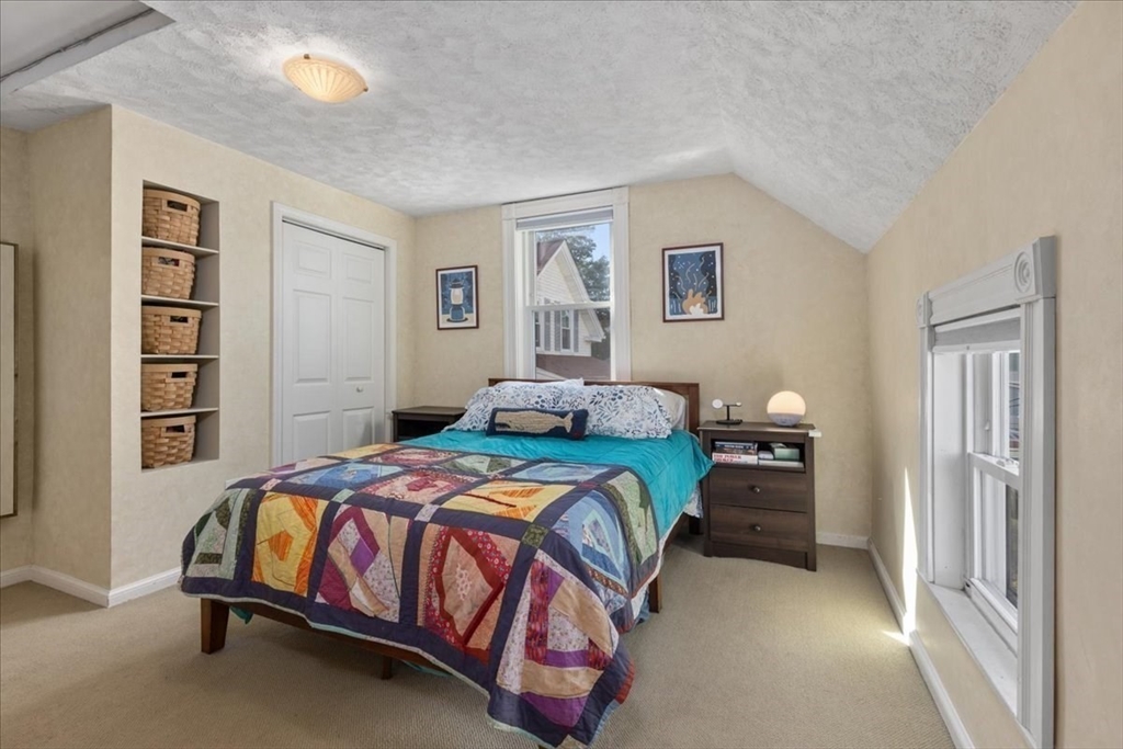 9 John Street Waltham, MA 02453 - Photo 31 of 43 a bedroom with a bed and a window