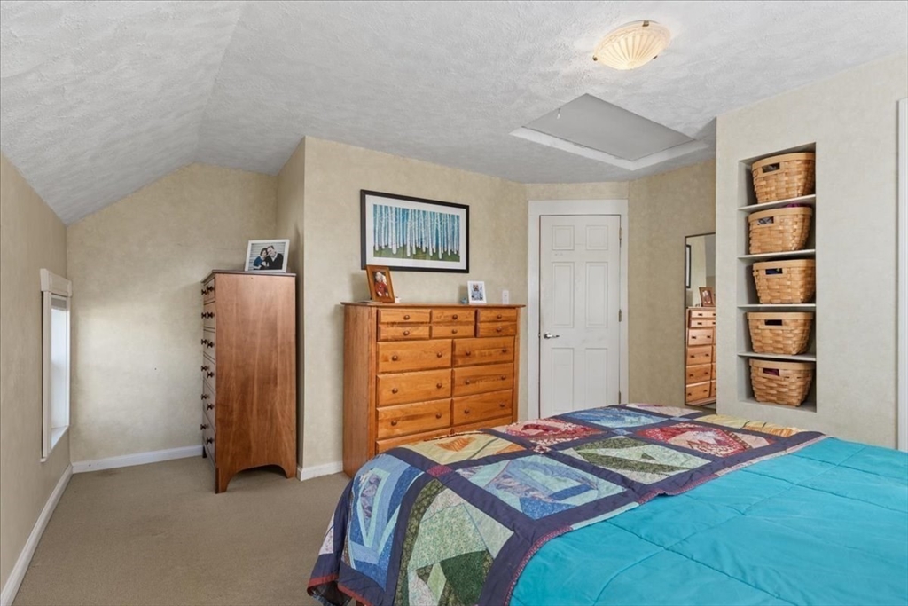 9 John Street Waltham, MA 02453 - Photo 32 of 43 a bedroom with a bed and a closet